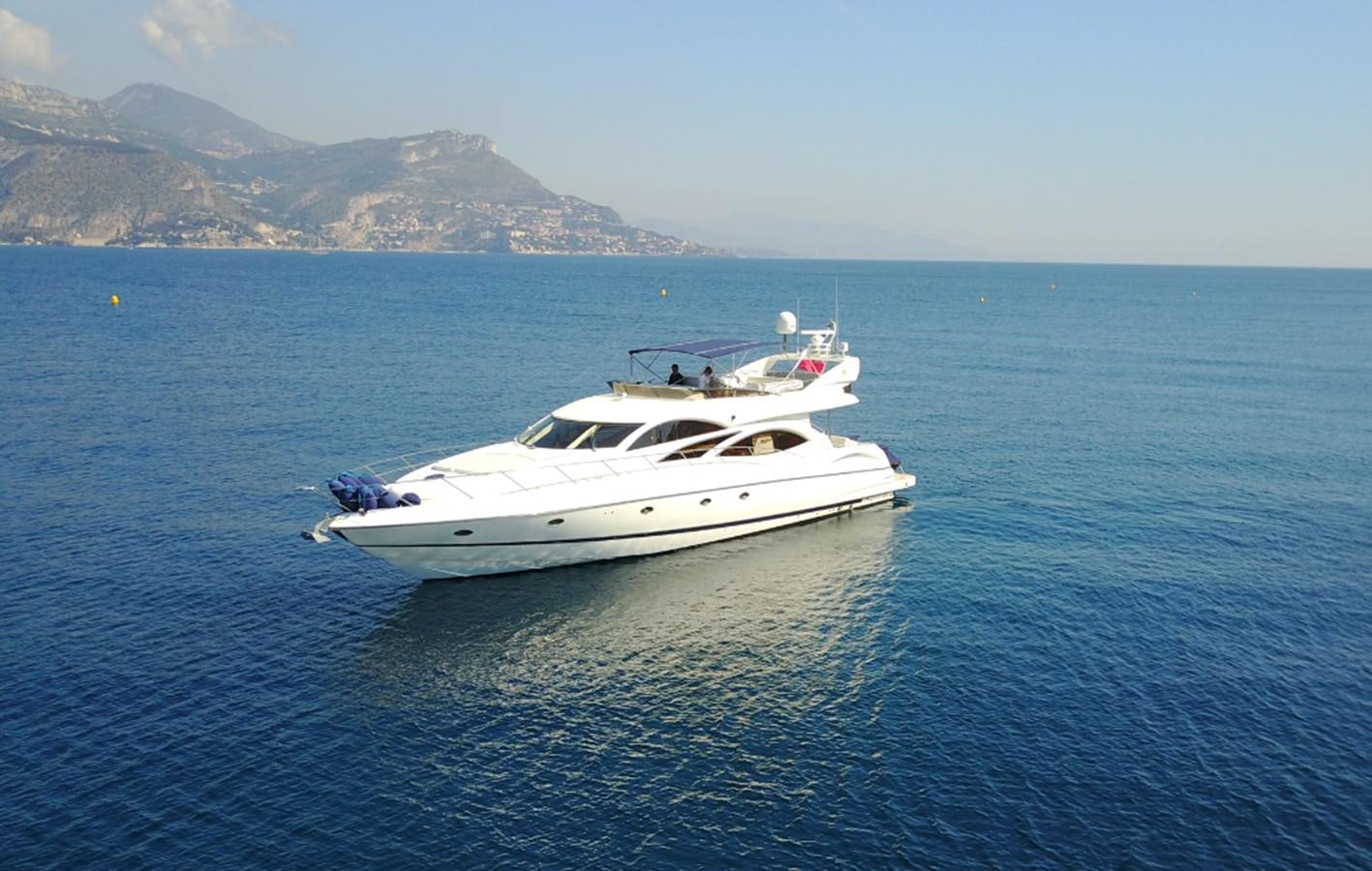 a white yacht in the water aboard NIKA Yacht for Sale