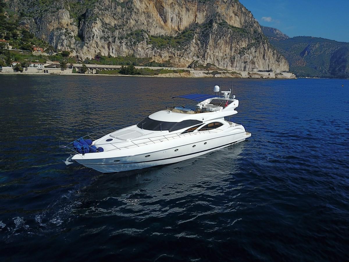 a white boat in the water aboard NIKA Yacht for Sale