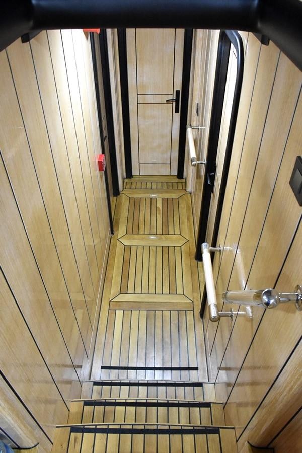 a hallway with a door aboard NOSTALGIA Yacht for Sale