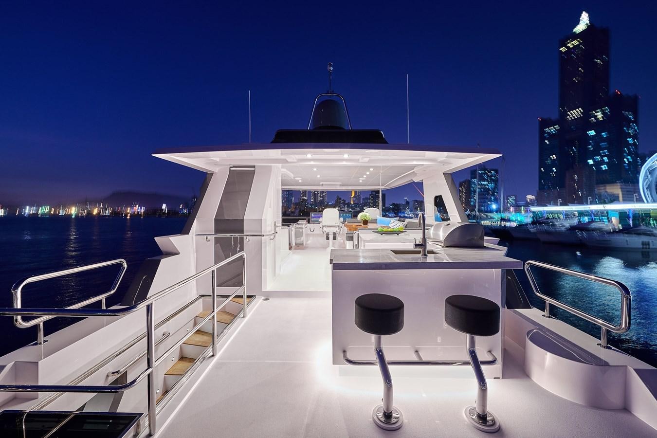 a deck with chairs and a table on it aboard V68 (NEW BOAT SPEC)  Yacht for Sale