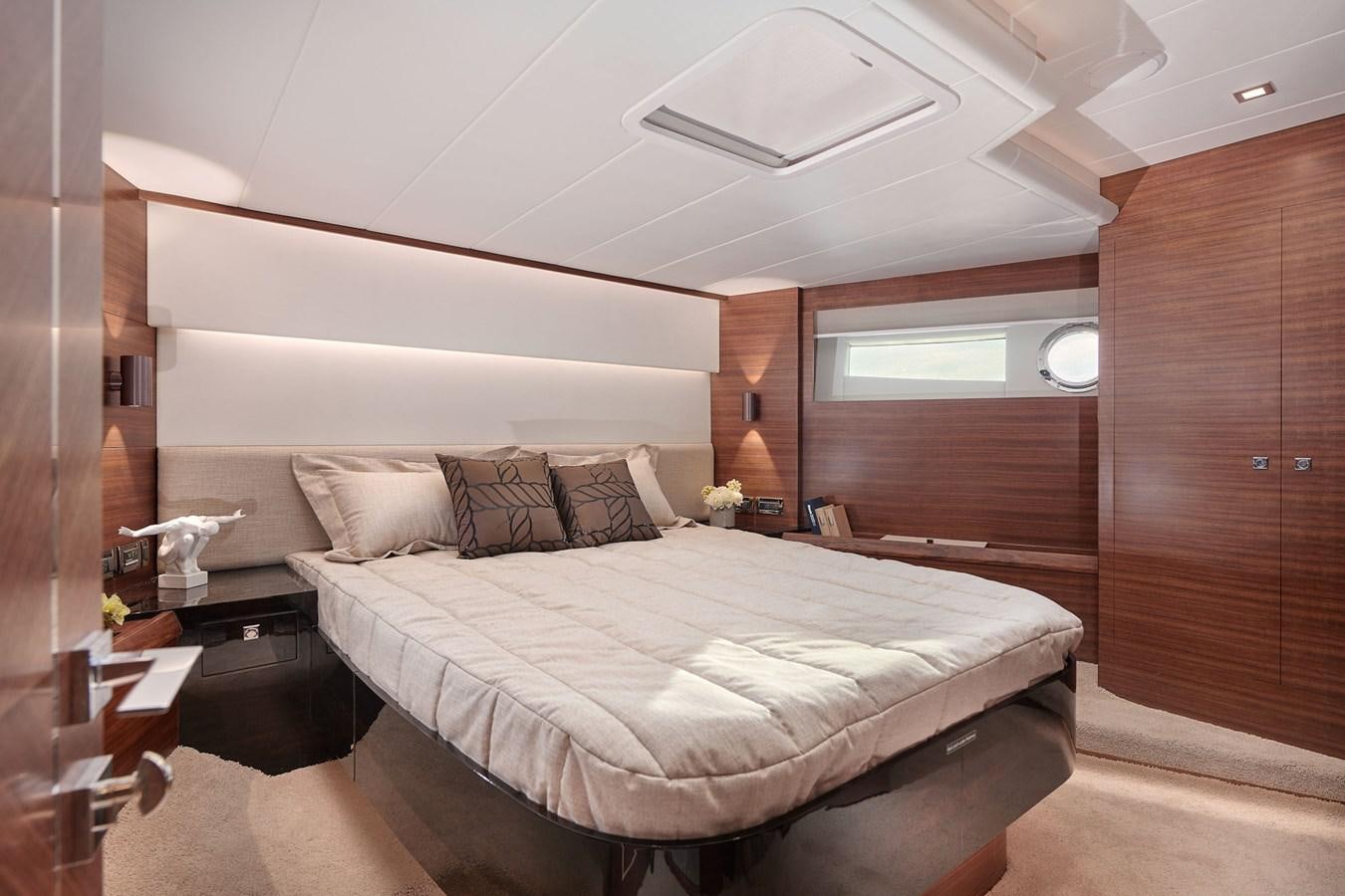 a room with a bed and a lamp aboard V68 (NEW BOAT SPEC)  Yacht for Sale