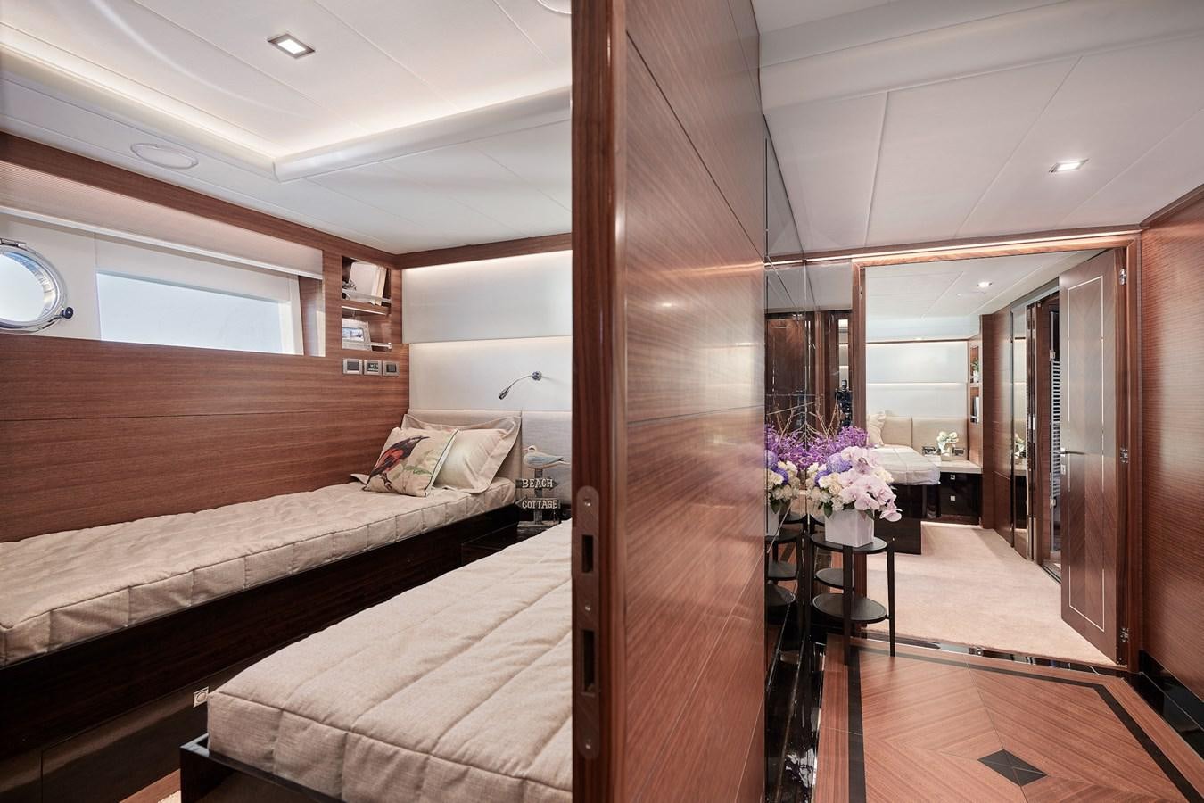 a room with a bed and a table aboard V68 (NEW BOAT SPEC)  Yacht for Sale