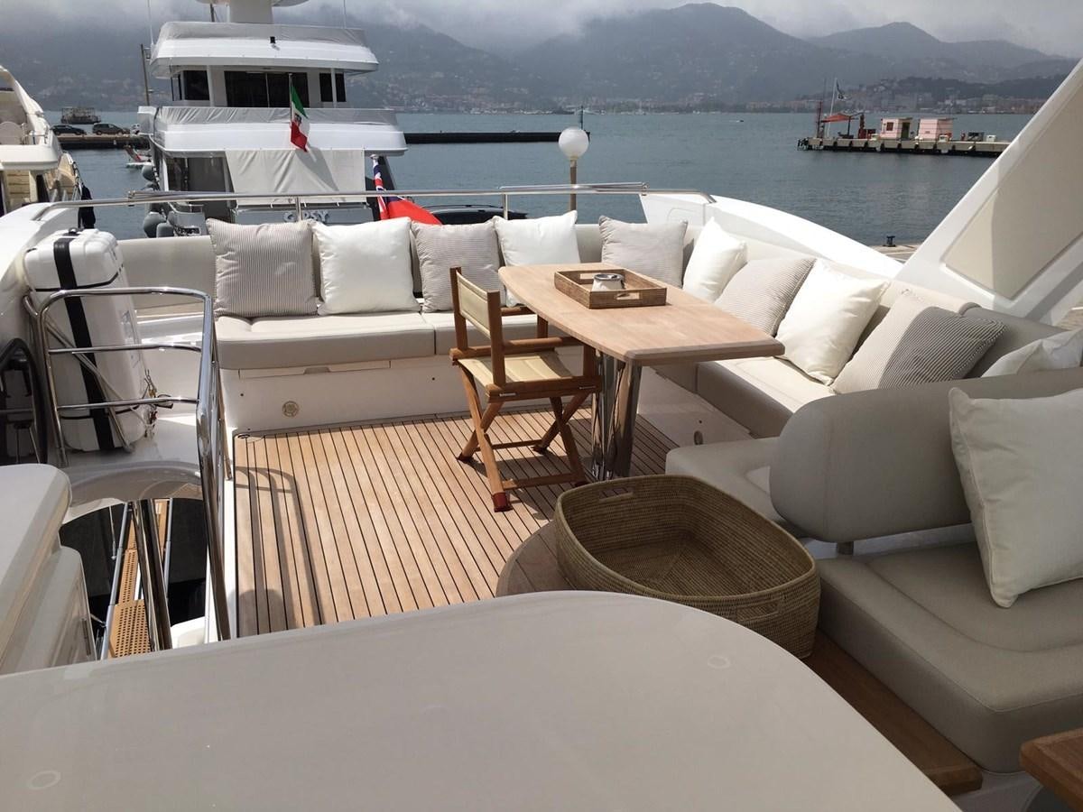a room with a couch and a table and chairs aboard AHAVA Yacht for Sale