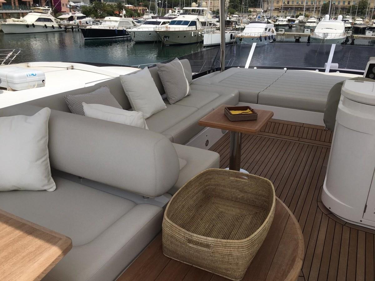 a room with a couch and a table and chairs aboard AHAVA Yacht for Sale
