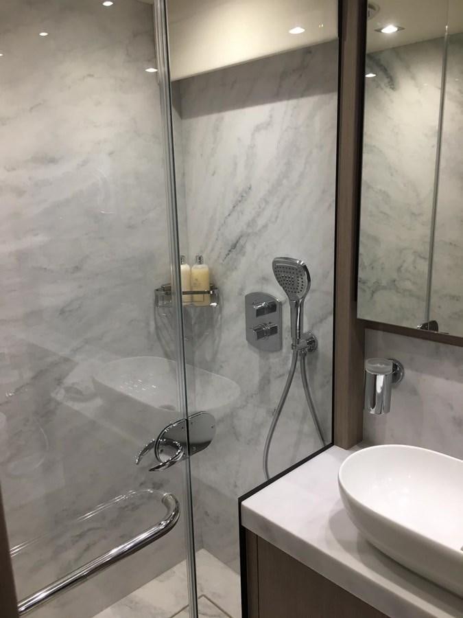 a shower with a glass door aboard AHAVA Yacht for Sale