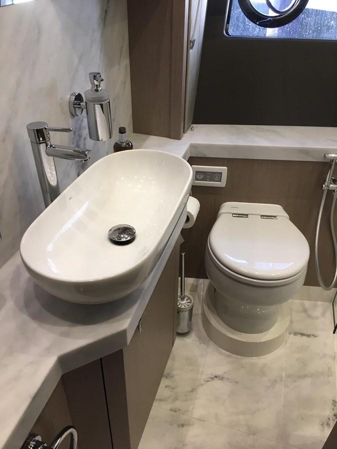 a sink and a toilet in a bathroom aboard AHAVA Yacht for Sale