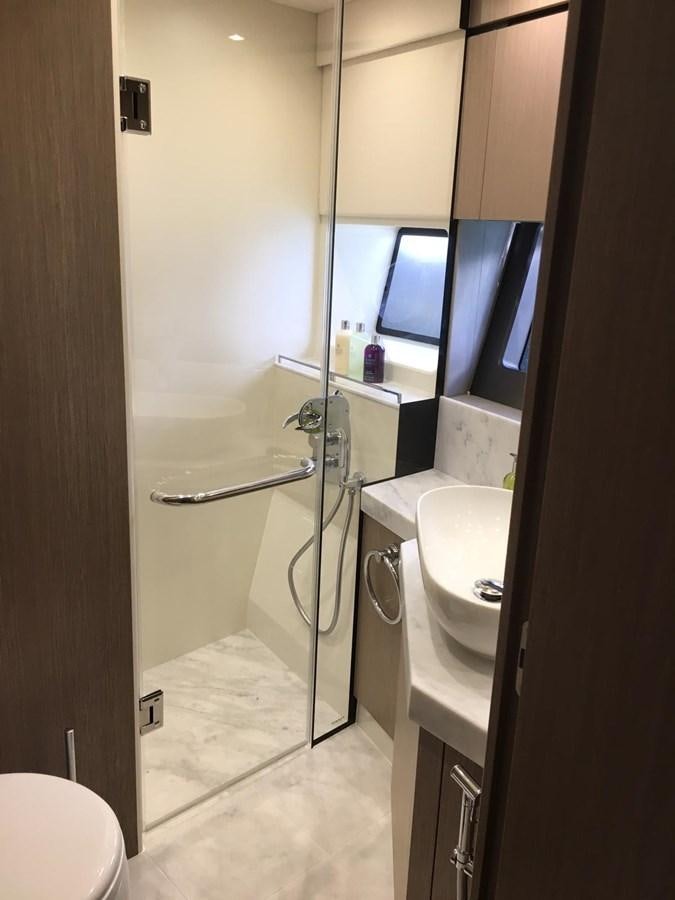 a bathroom with a large shower aboard AHAVA Yacht for Sale