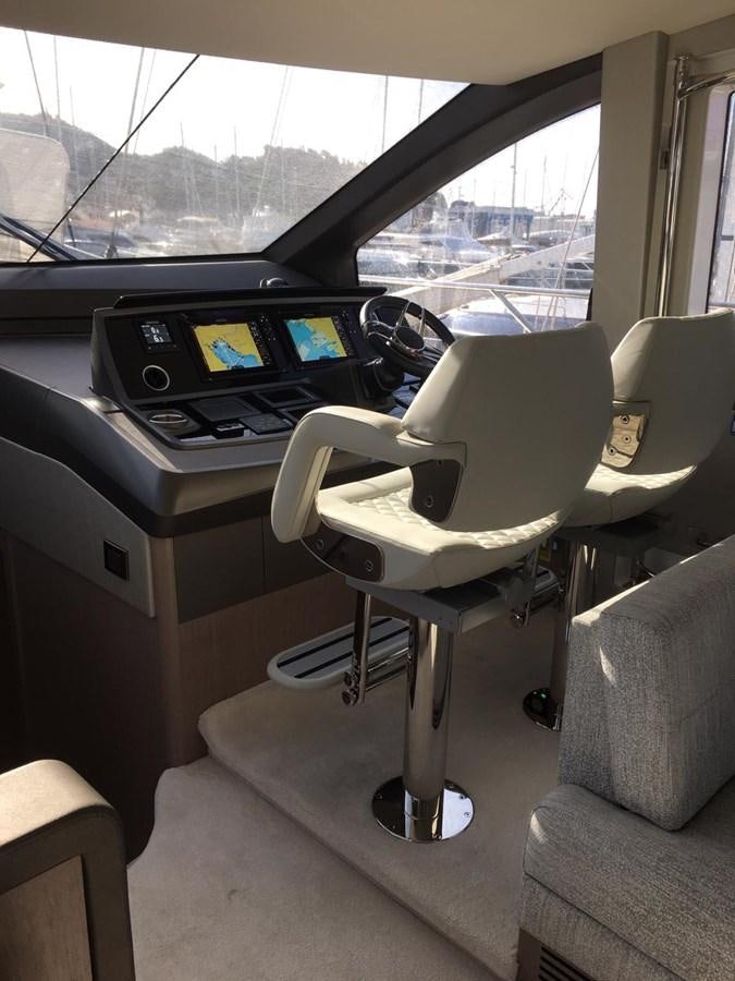 a car with a desk and a computer aboard AHAVA Yacht for Sale