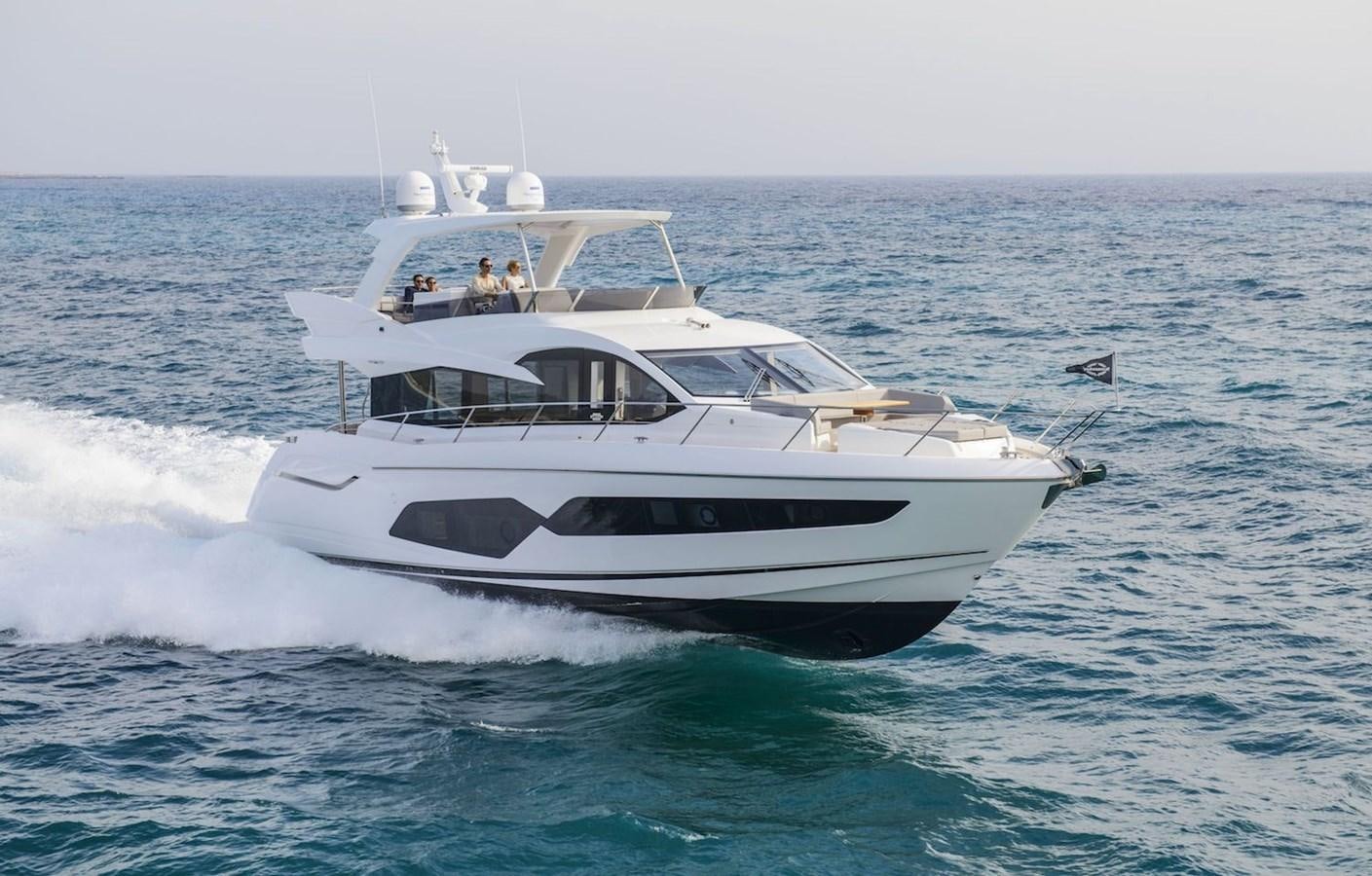 a white yacht on the water aboard AHAVA Yacht for Sale