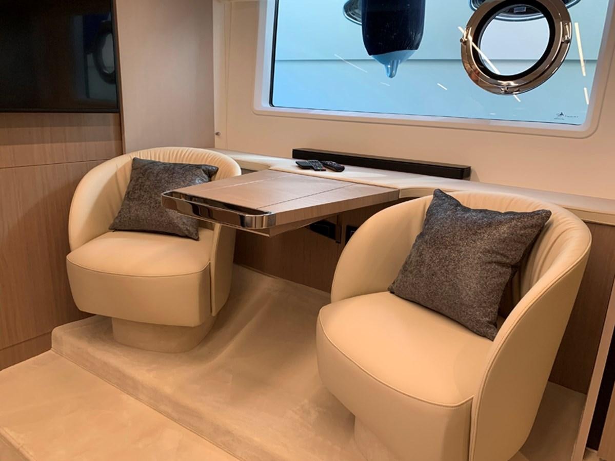 a room with a desk and a chair aboard IMAGINE Yacht for Sale