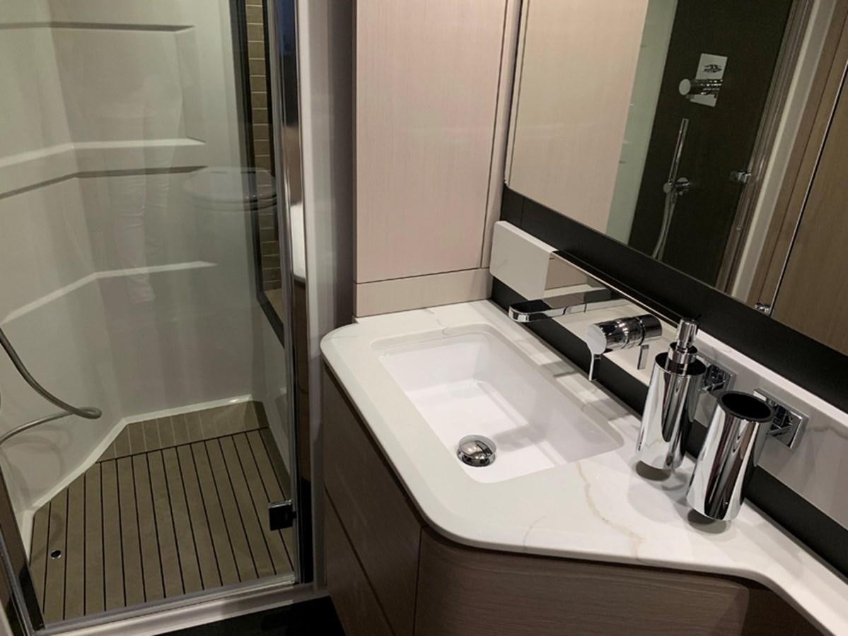 a bathroom with a sink and a mirror aboard IMAGINE Yacht for Sale