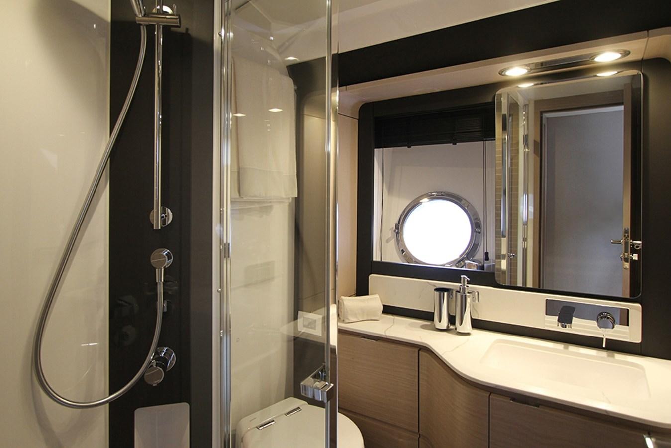 a bathroom with a large mirror aboard IMAGINE Yacht for Sale