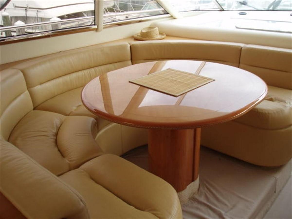a coffee table on a couch aboard FOREVER SUMMER Yacht for Sale