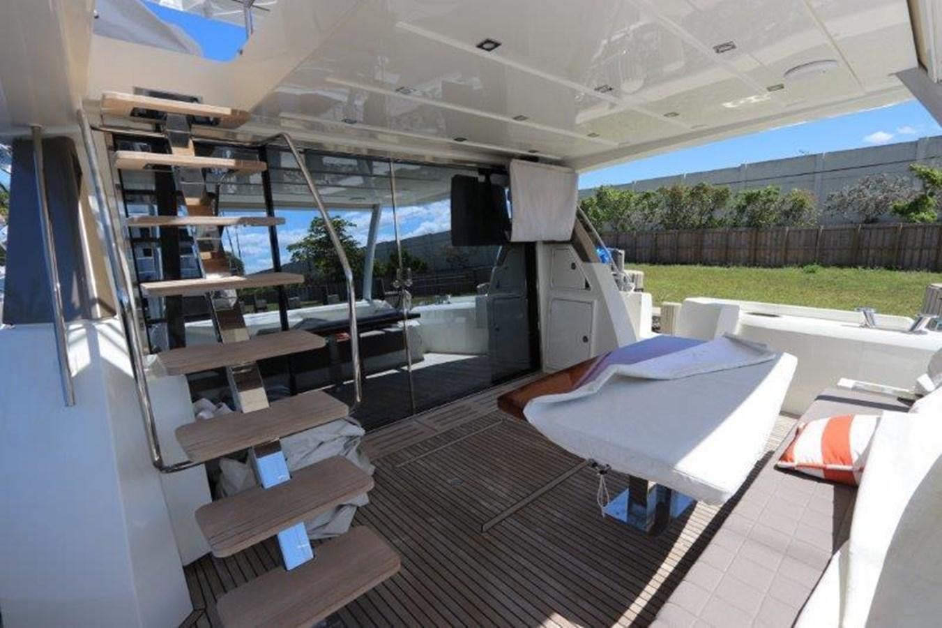 a room with a table and chairs aboard BREATHE EASY Yacht for Sale