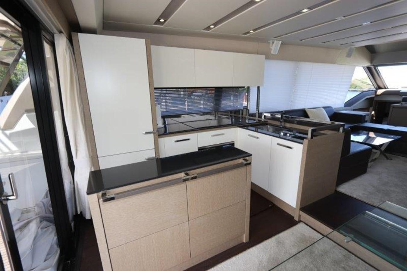 a kitchen with white cabinets aboard BREATHE EASY Yacht for Sale