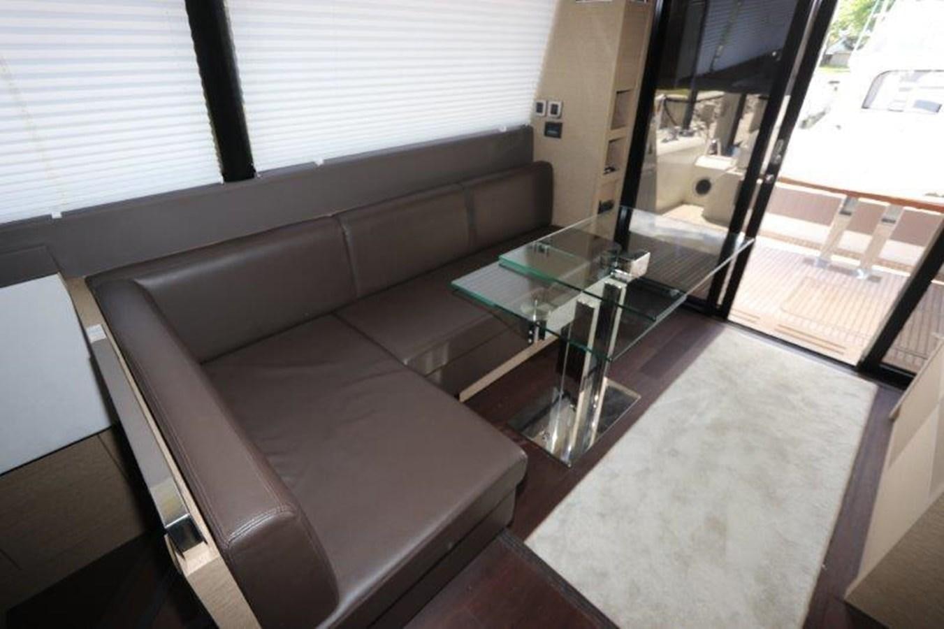 a glass table in a room aboard BREATHE EASY Yacht for Sale