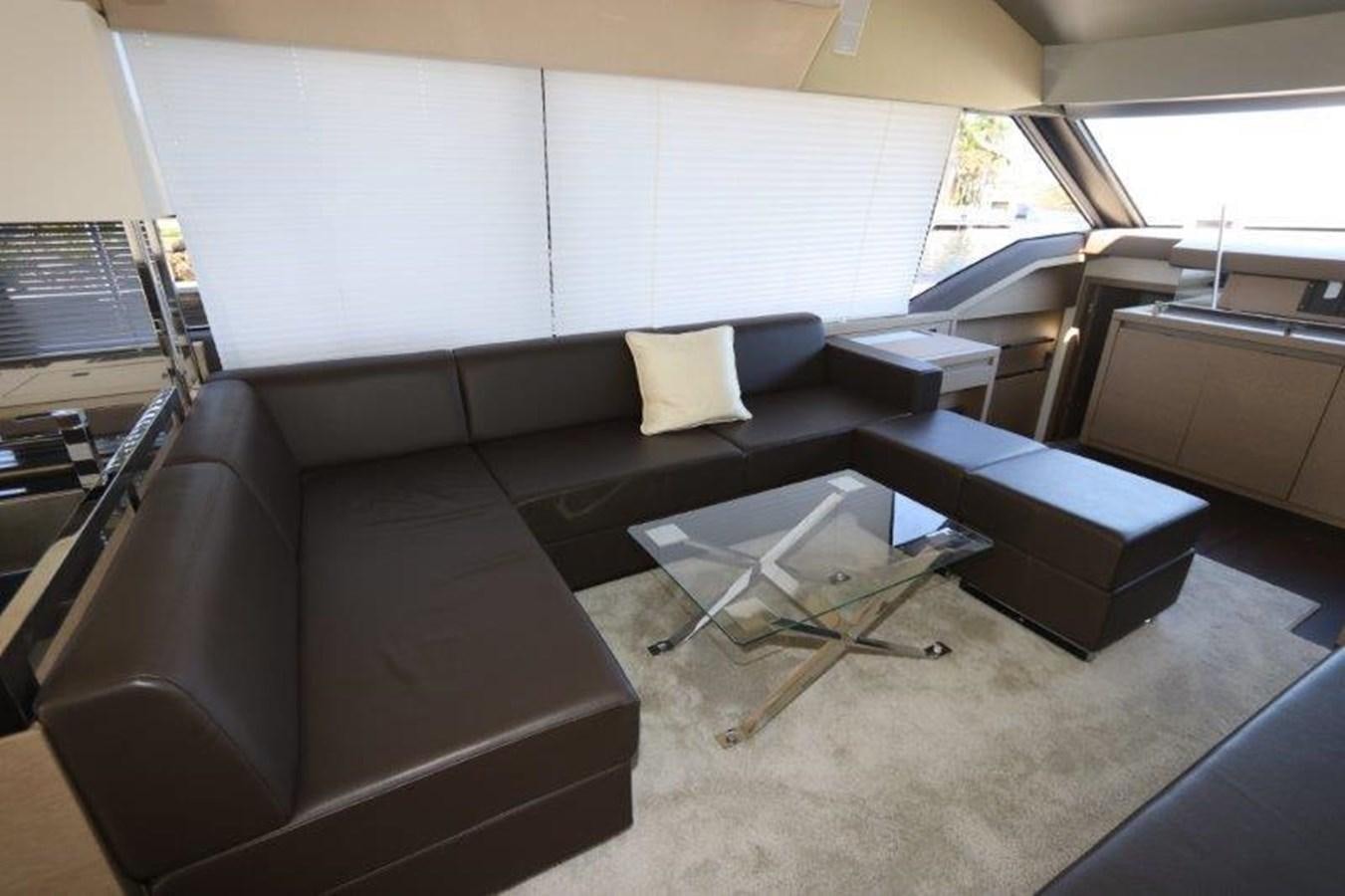 a room with couches and a table aboard BREATHE EASY Yacht for Sale