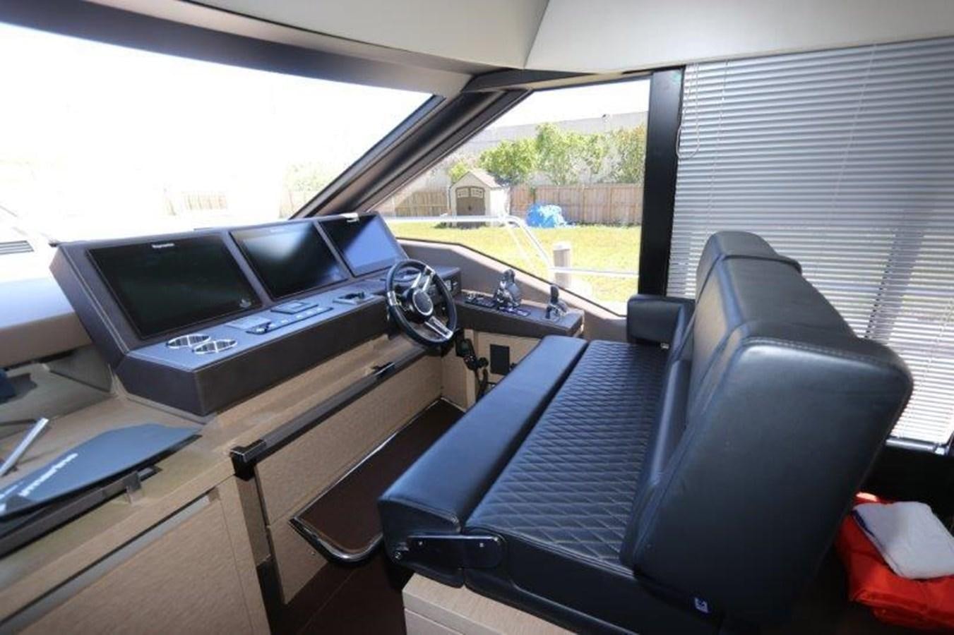 a black chair in a room aboard BREATHE EASY Yacht for Sale