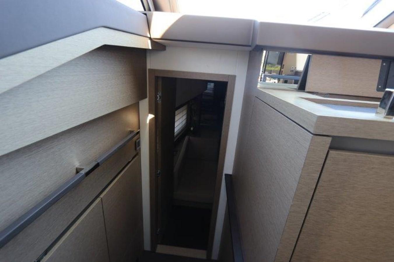 a room with a door and a window aboard BREATHE EASY Yacht for Sale
