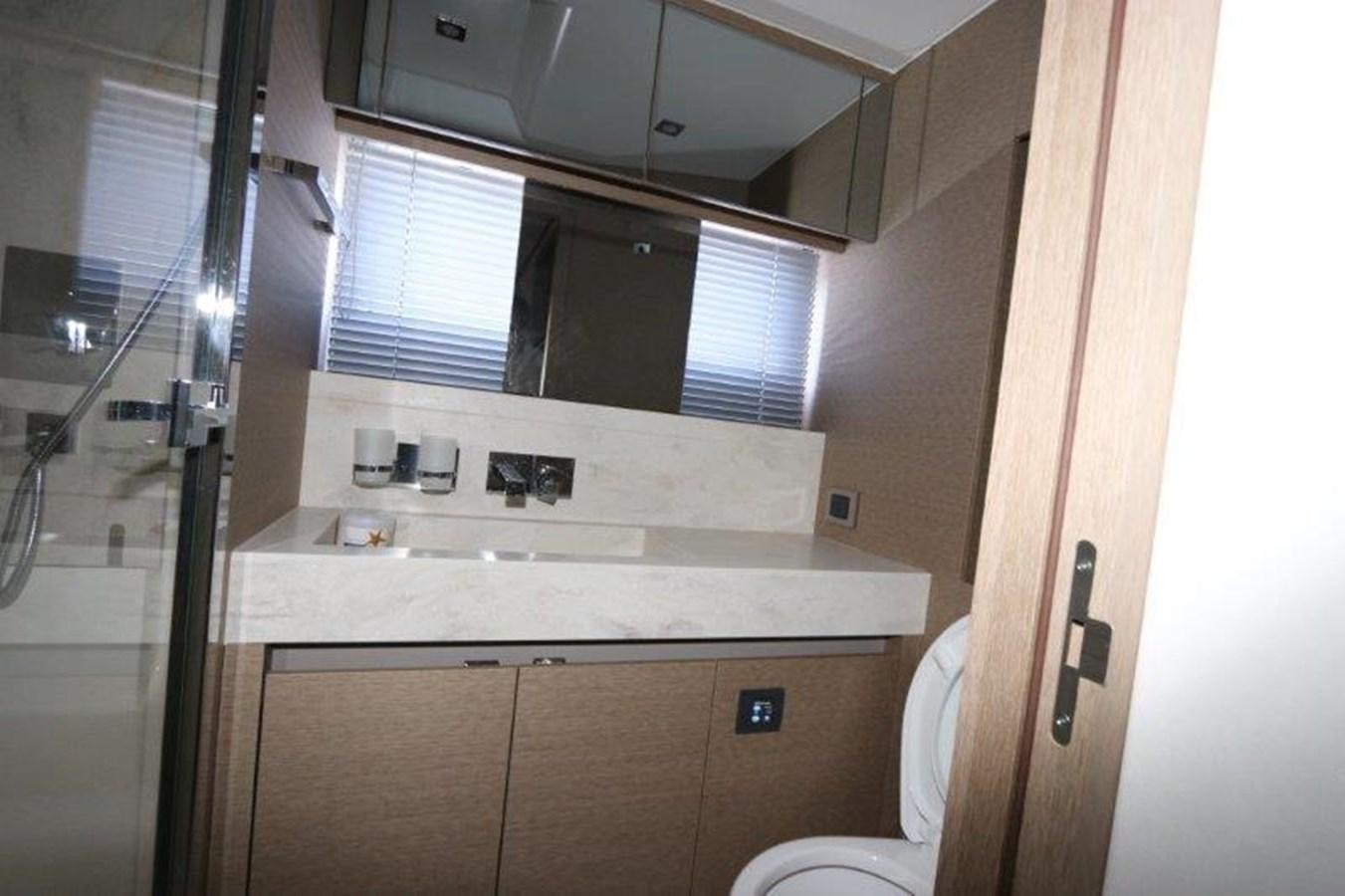 a bathroom with a sink and a toilet aboard BREATHE EASY Yacht for Sale