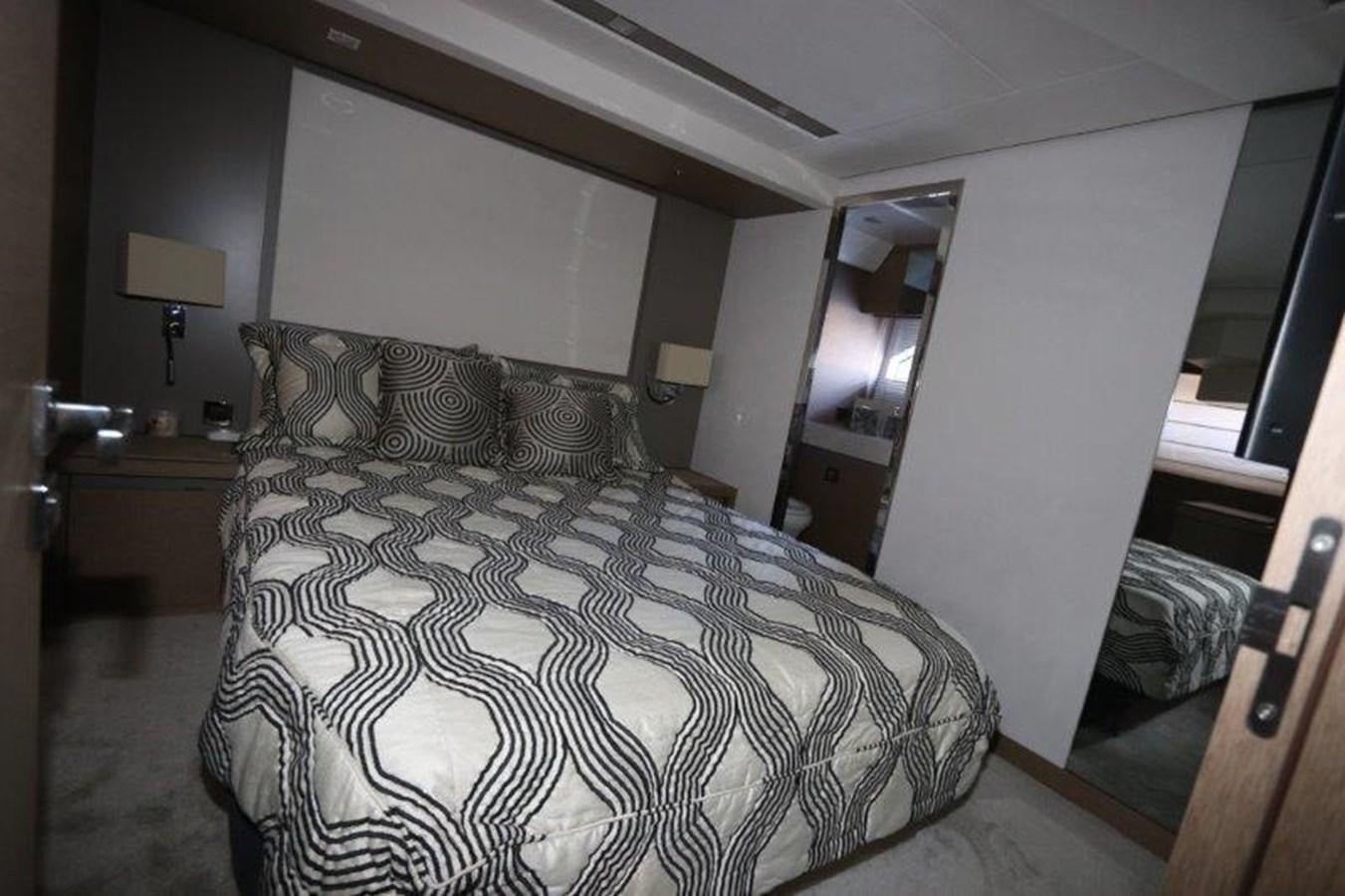 a bed in a room aboard BREATHE EASY Yacht for Sale