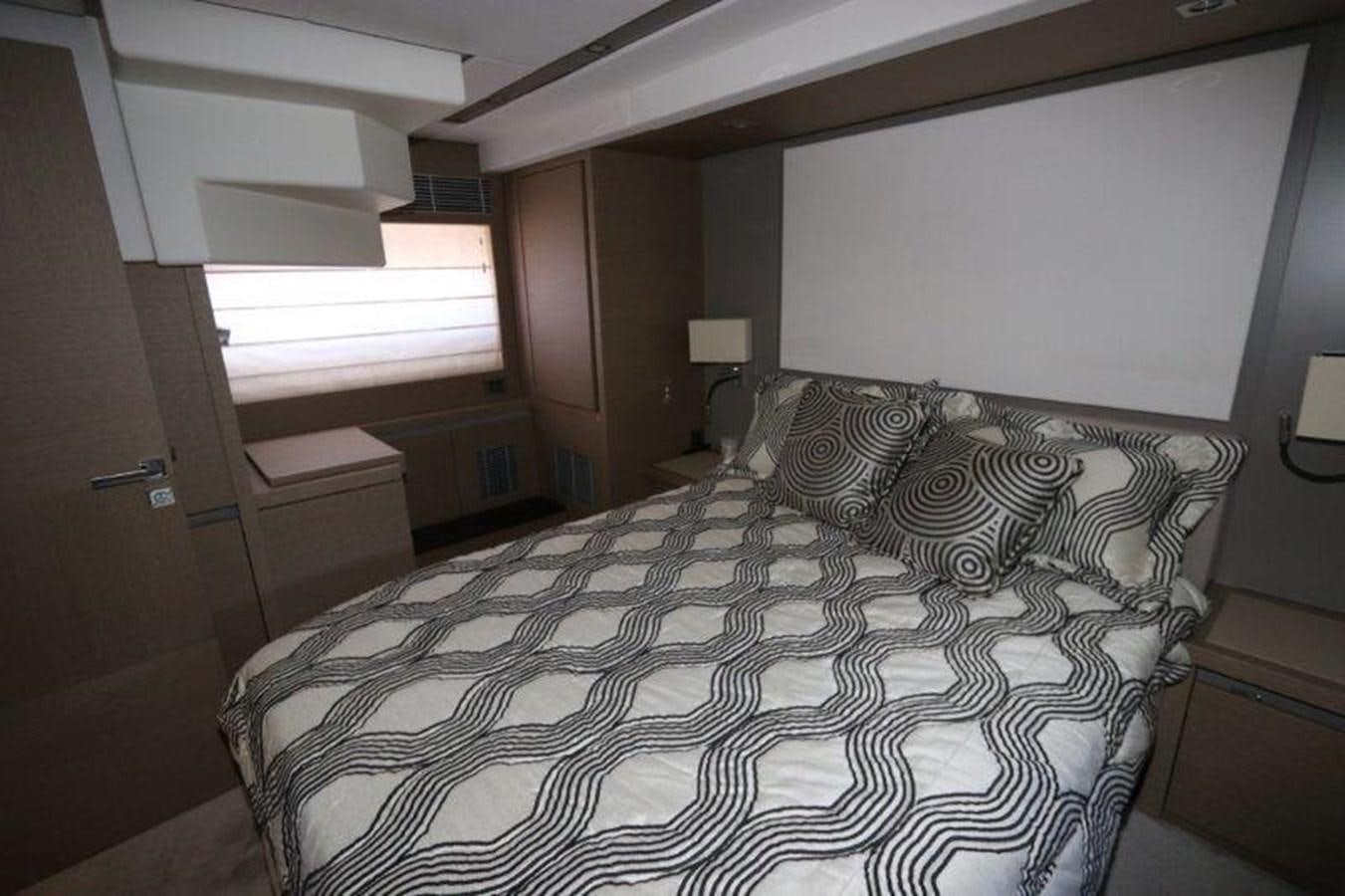a bed with a black comforter aboard BREATHE EASY Yacht for Sale