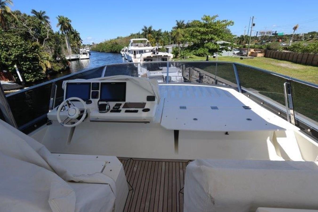 a boat with a car on it aboard BREATHE EASY Yacht for Sale