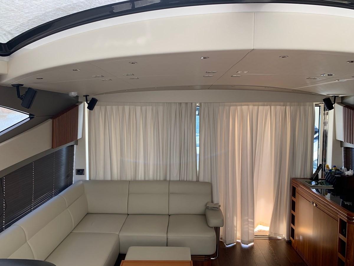 a room with a couch and a window aboard PIECE OF SHIP Yacht for Sale