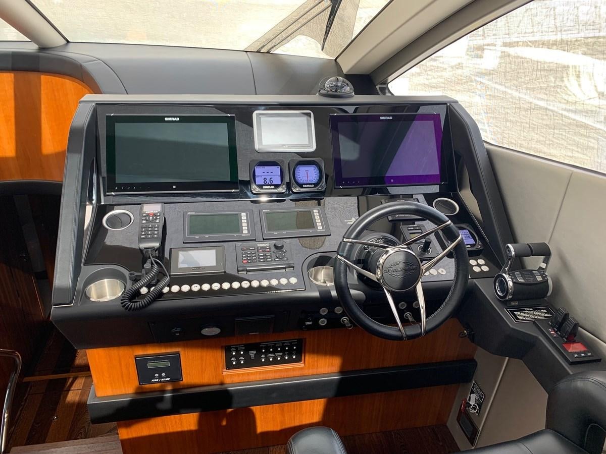 a car with a screen and buttons aboard PIECE OF SHIP Yacht for Sale