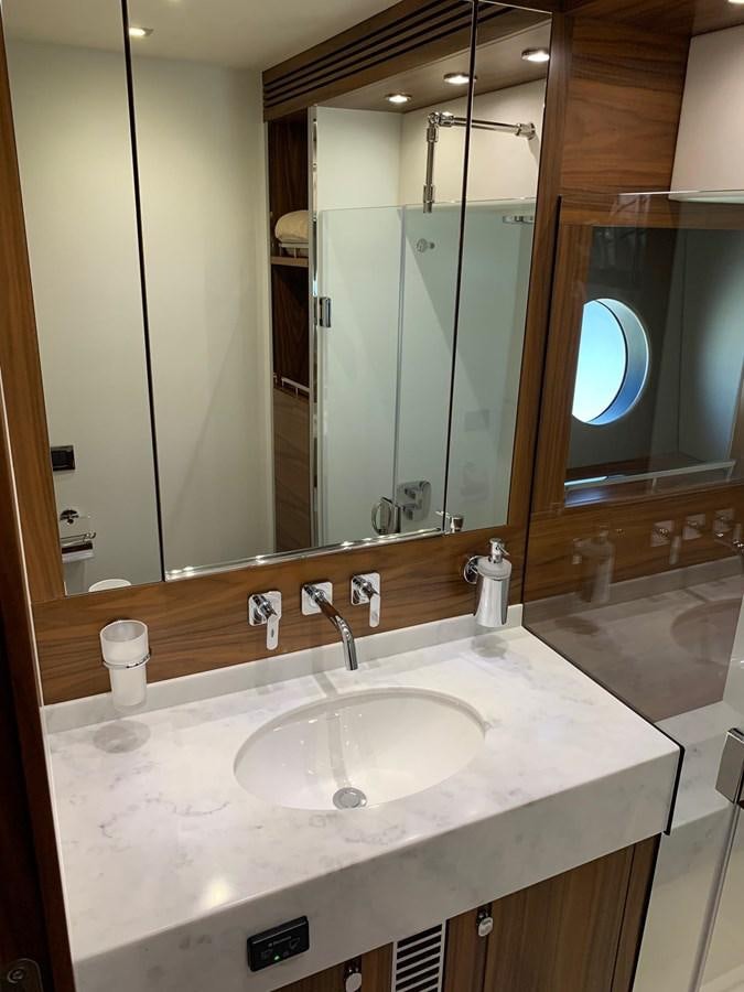 a bathroom with a large mirror aboard PIECE OF SHIP Yacht for Sale