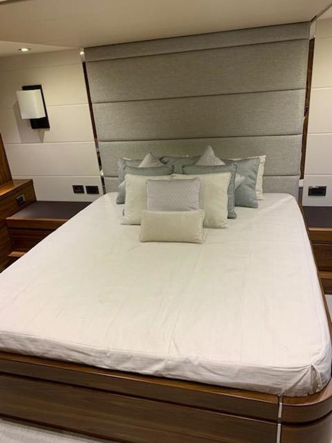 a bed with white sheets aboard PIECE OF SHIP Yacht for Sale