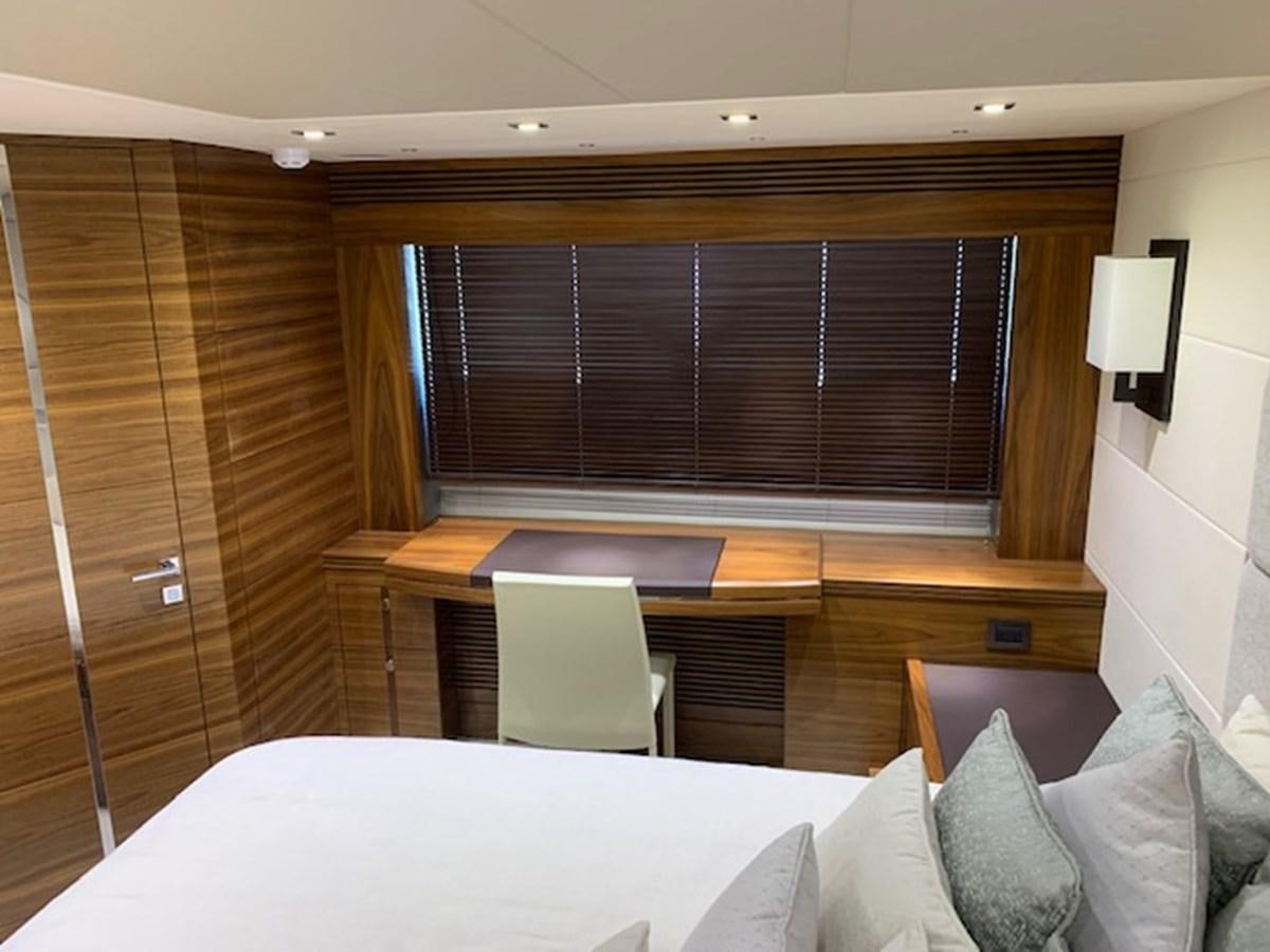 a room with a bed and a desk aboard PIECE OF SHIP Yacht for Sale