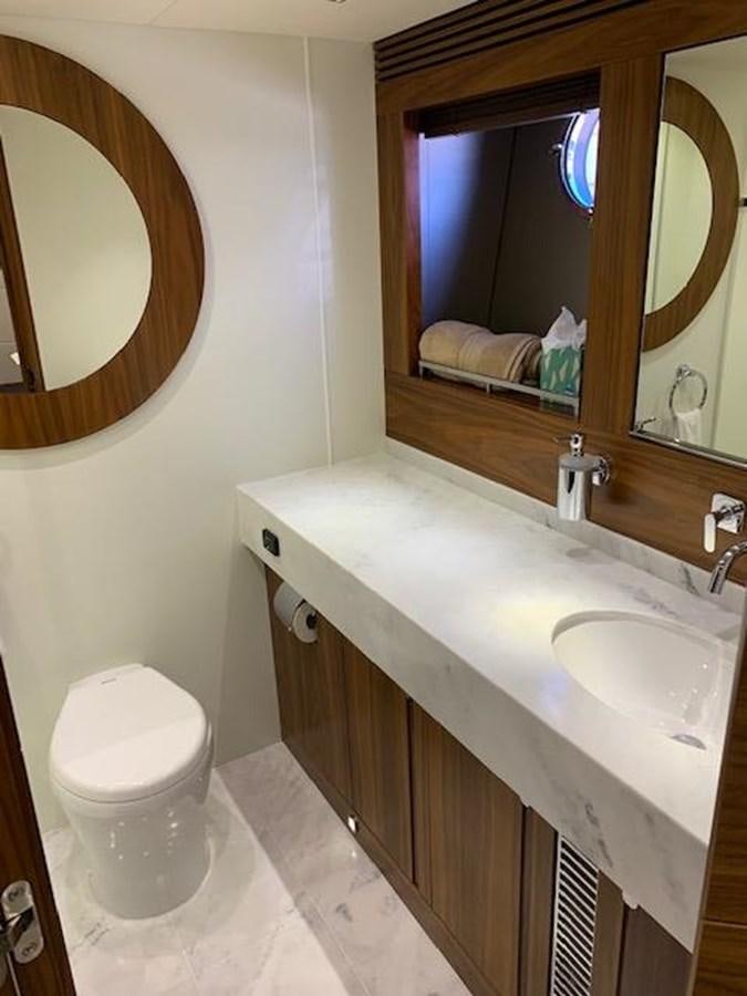 a bathroom with a sink and a toilet aboard PIECE OF SHIP Yacht for Sale