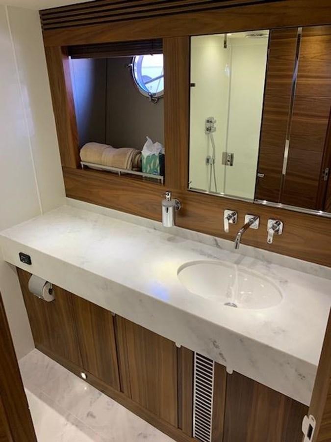 a bathroom with a large mirror aboard PIECE OF SHIP Yacht for Sale