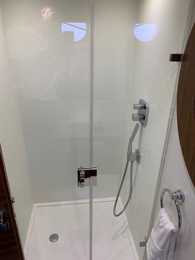 a shower with a glass door aboard PIECE OF SHIP Yacht for Sale