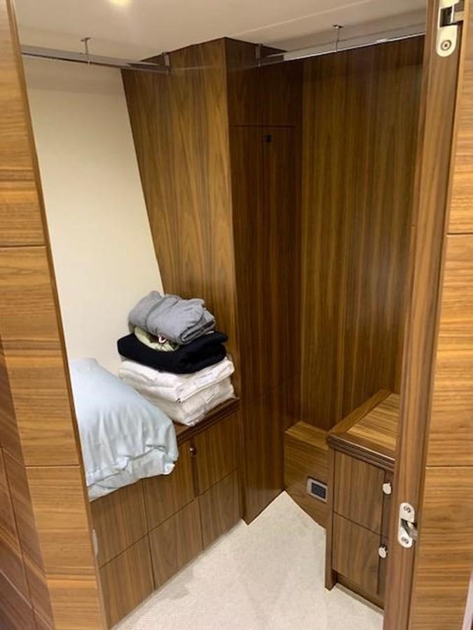 a room with a closet and a bed aboard PIECE OF SHIP Yacht for Sale