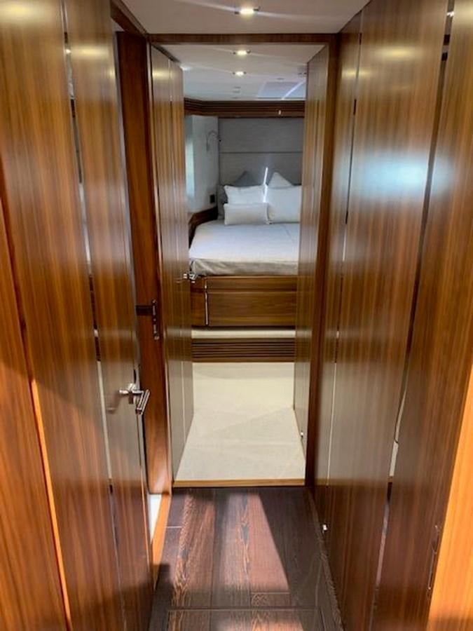 a room with a bed and a wood door aboard PIECE OF SHIP Yacht for Sale