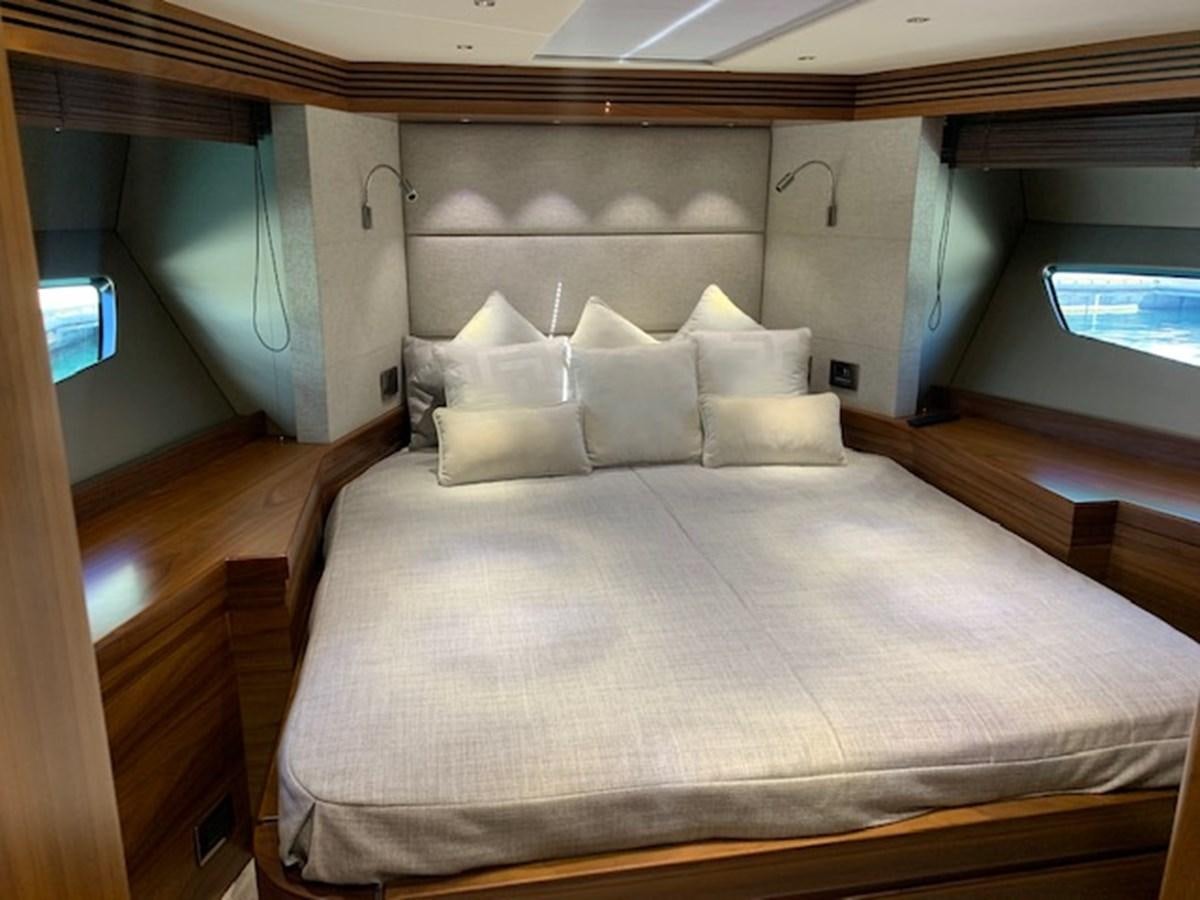 a bed with white sheets aboard PIECE OF SHIP Yacht for Sale