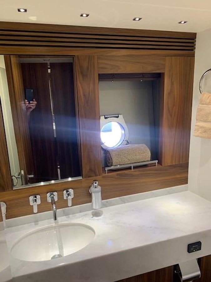 a bathroom with a large mirror aboard PIECE OF SHIP Yacht for Sale