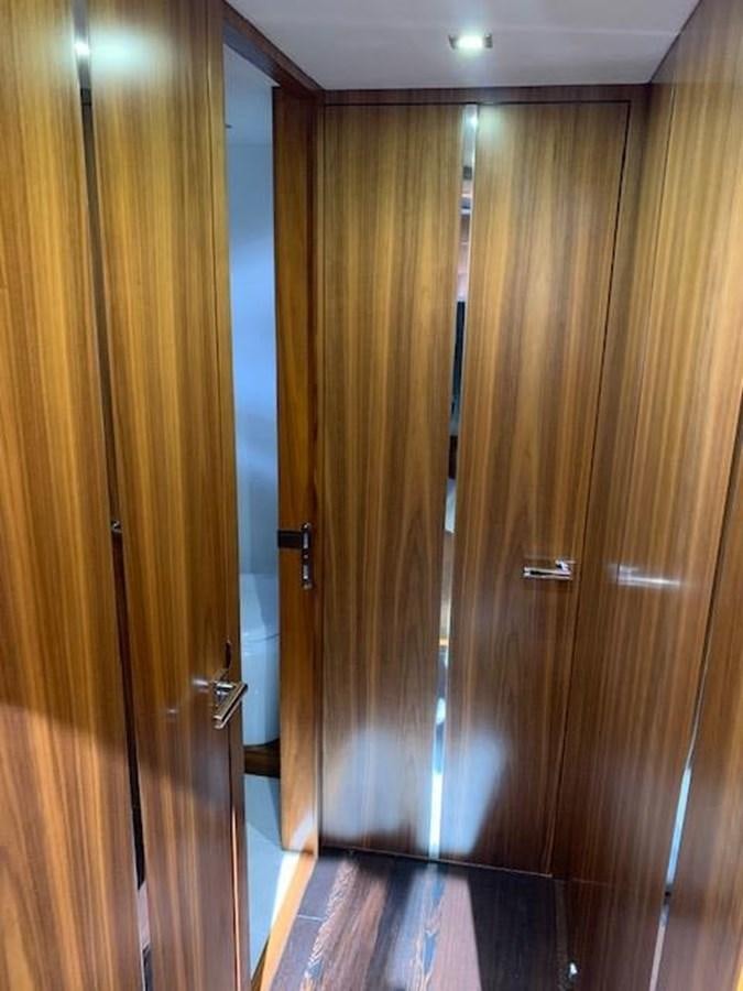 a room with wooden cabinets aboard PIECE OF SHIP Yacht for Sale