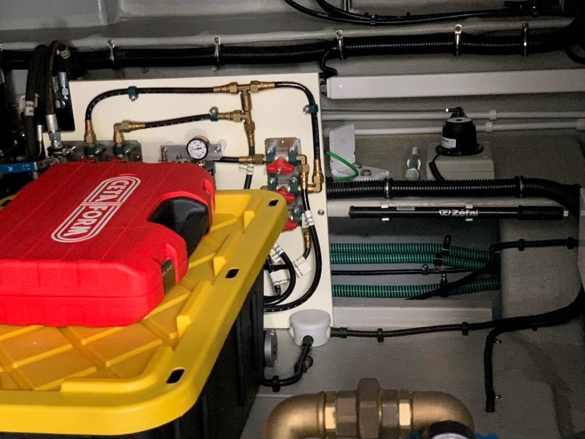 a red and yellow race car aboard PIECE OF SHIP Yacht for Sale