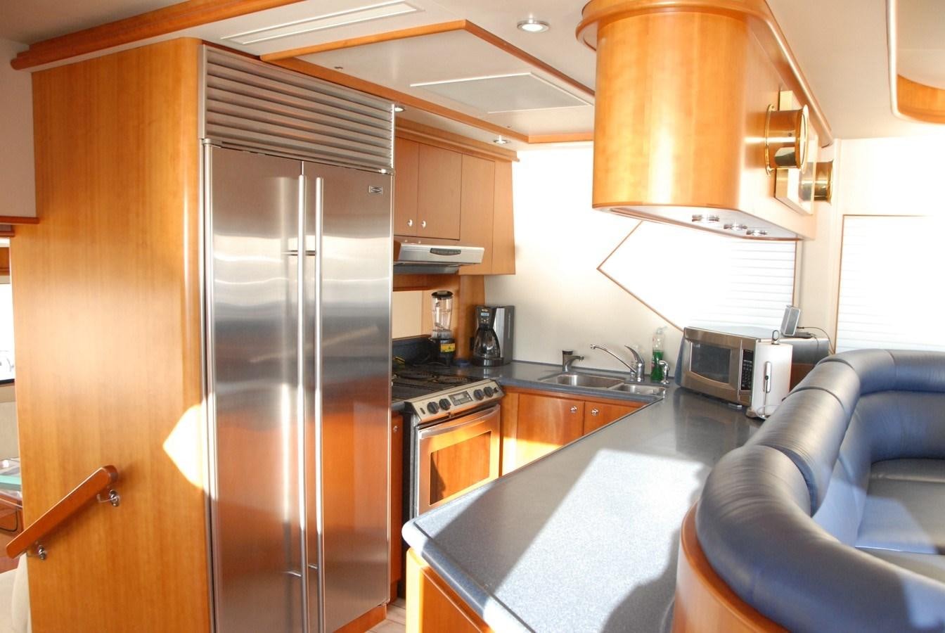 a kitchen with stainless steel appliances aboard ROOM SERVICE Yacht for Sale