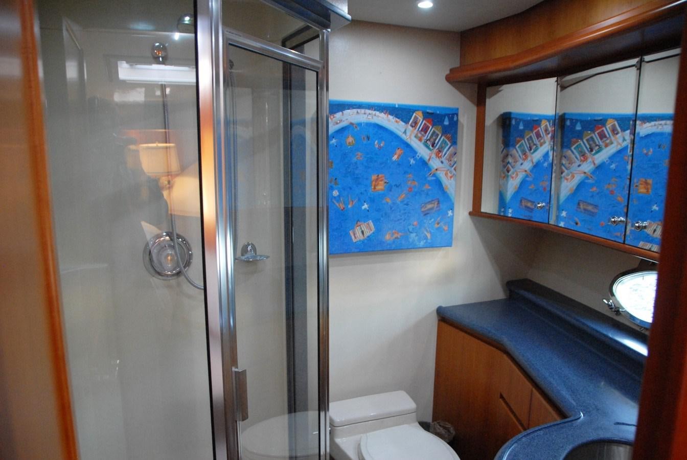 a bathroom with a glass shower aboard ROOM SERVICE Yacht for Sale