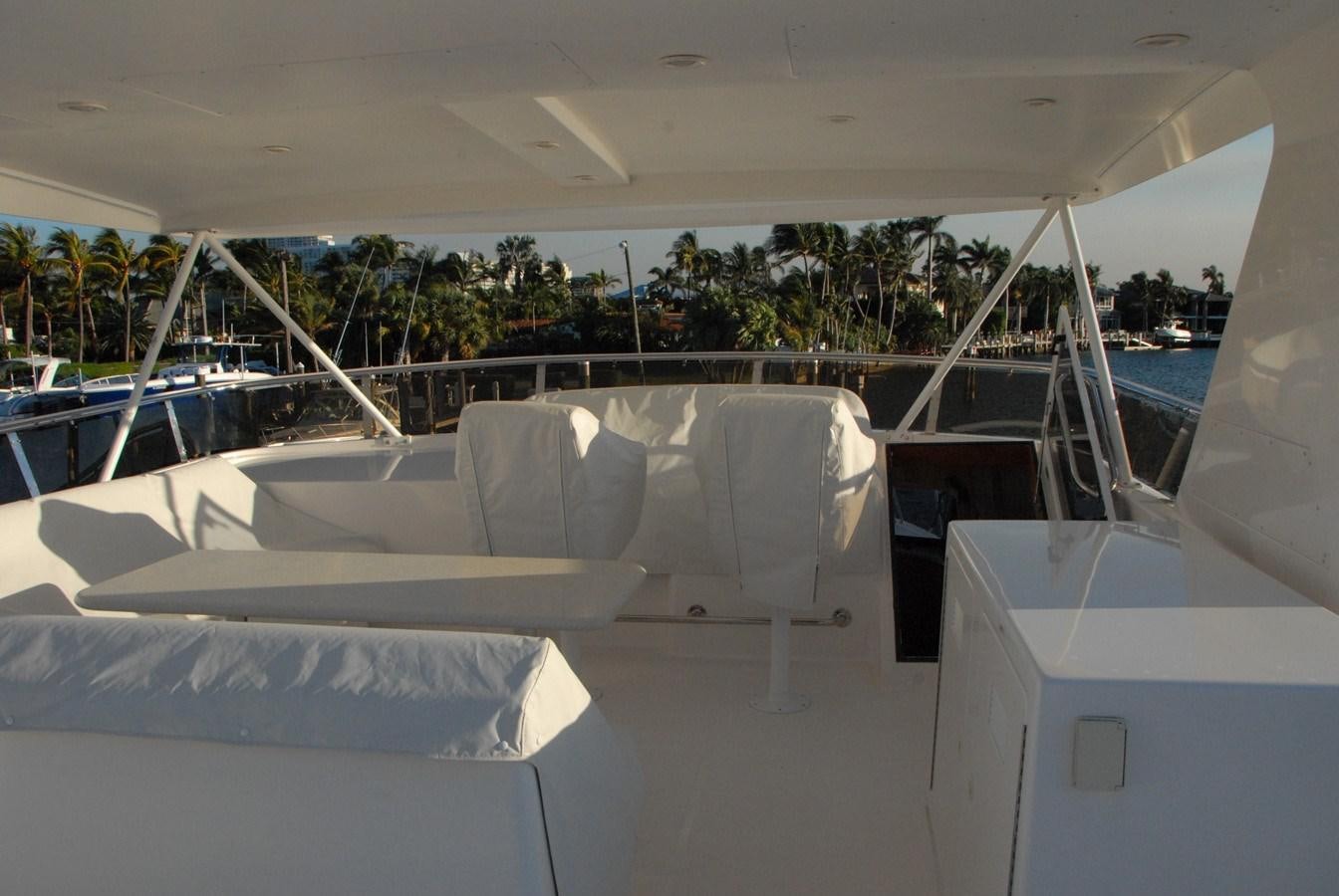 a row of white lounge chairs aboard ROOM SERVICE Yacht for Sale