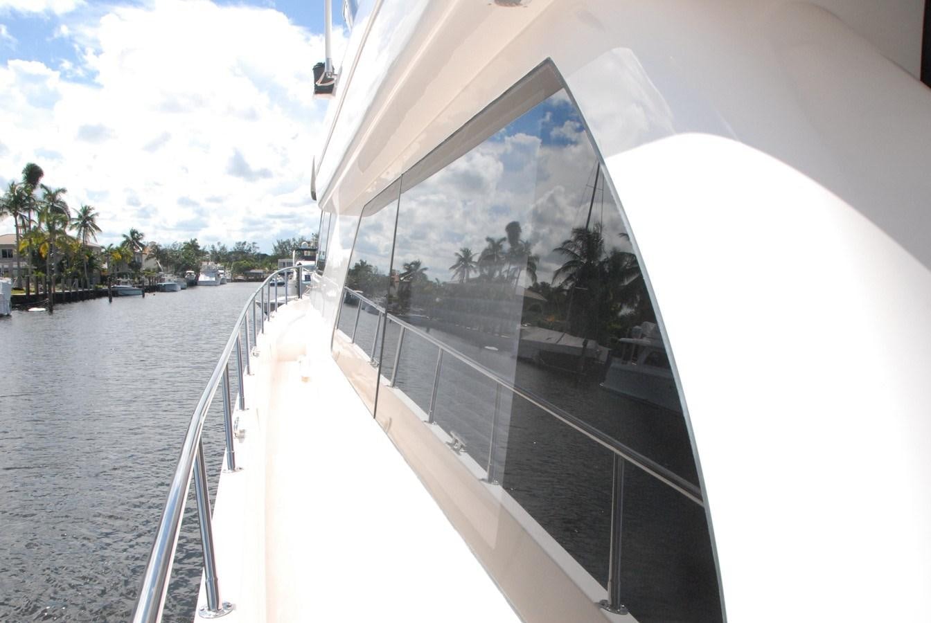 a large white boat on the water aboard ROOM SERVICE Yacht for Sale