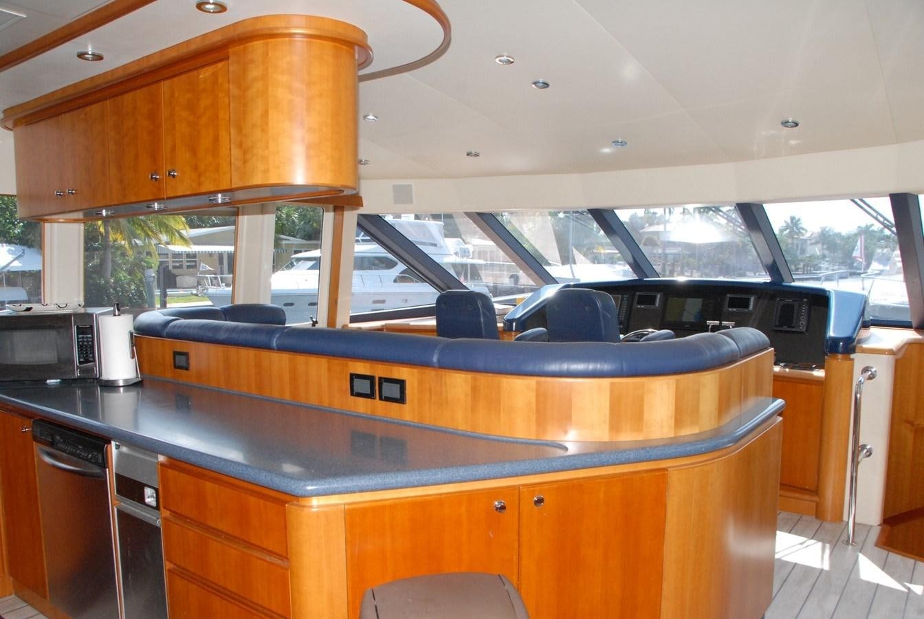 a kitchen with a large island aboard ROOM SERVICE Yacht for Sale