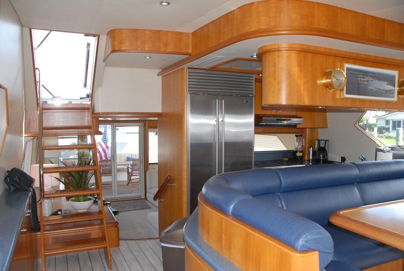 a living room with a couch and a tv aboard ROOM SERVICE Yacht for Sale
