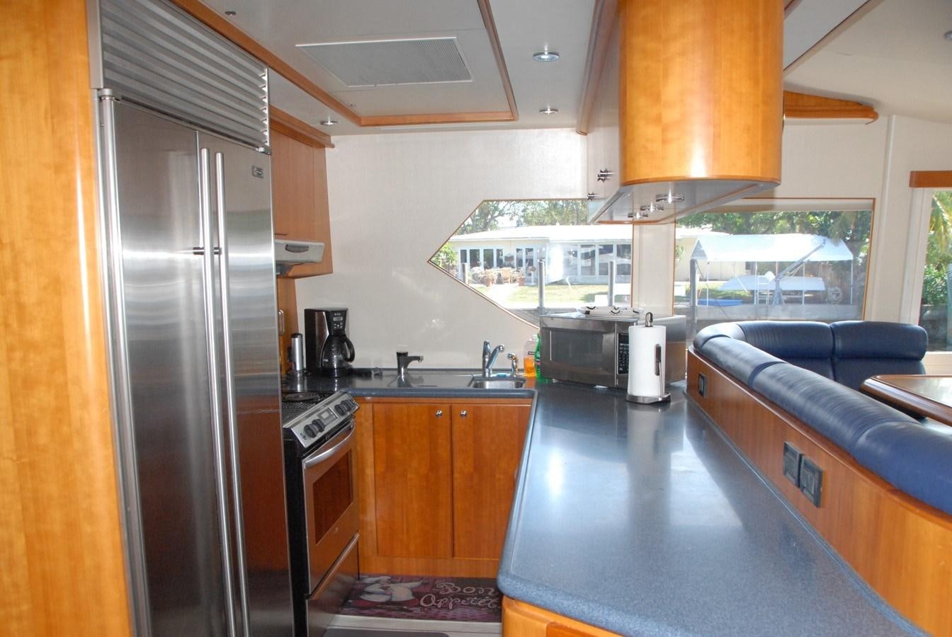 a kitchen with a large refrigerator aboard ROOM SERVICE Yacht for Sale