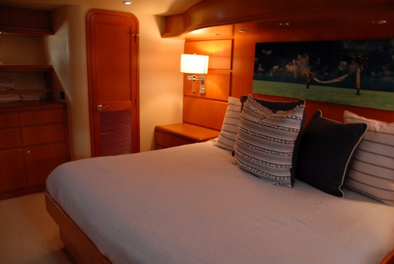 a bed with pillows and pillows aboard ROOM SERVICE Yacht for Sale