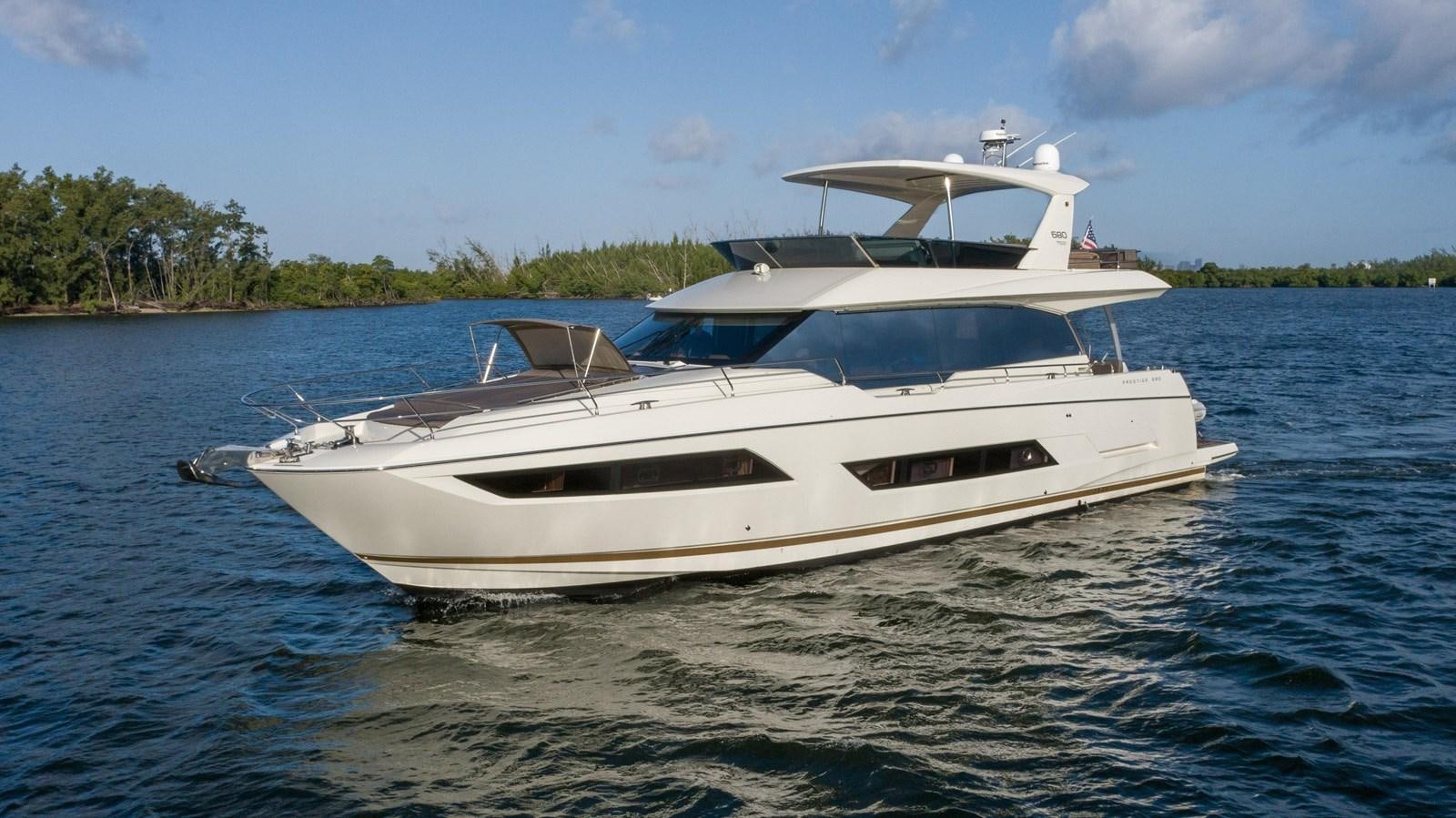 a white yacht on the water aboard VIMA Yacht for Sale